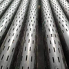 Close-up of precision slots on slotted pipe - uniform slot width (e.g., 0.020") for fine sand control